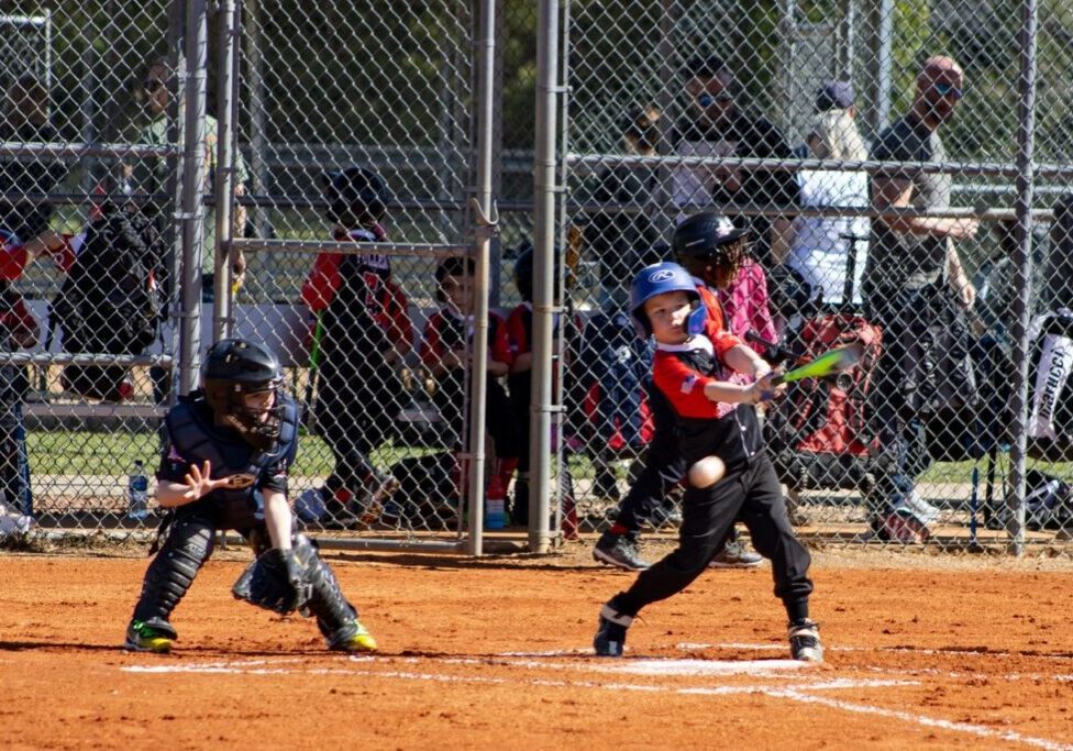 A baseball player swinging at the ball during a game.