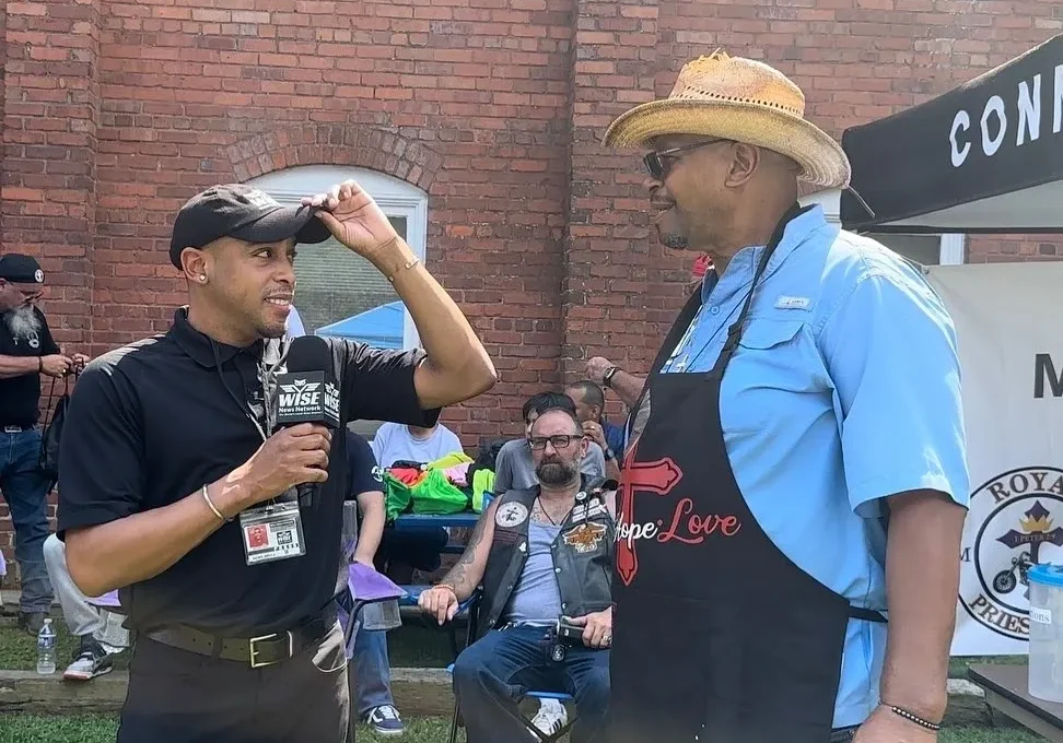 Wise News reporter, Jermaine Gash, interviewing Pastor Moses Colbert in front of the Faith, Hope, Love and Community Enrichment Ministries. The church hosted a fundraising event, put on by the Royal Priesthood Motorcycle Ministries - Pursuit chapter, to raise money for a homeless encampment that resides on the churches grounds. Saturday, 8/26/23, By Mason Beam, WNN.