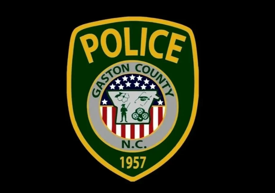 A green and white police patch on black background.