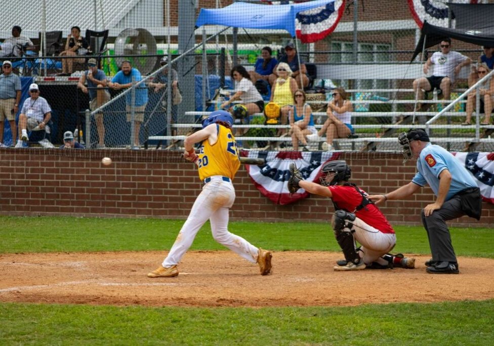 A baseball player swinging at a ball during a game.