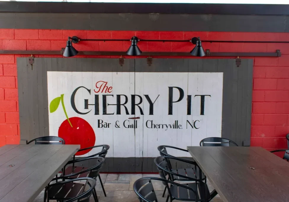 The original sliding barn door of the building placed on the new Cherry Pit patio - painted by Cherryville artist Gary Freeman, August 20th, 2024 by Mason Beam (WNN)